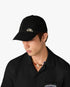 Casquette noire à rivet à logo superposé