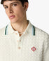 Polo à manches courtes blanc en tissu bouclé