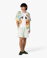 Short sportif vert en lin à rayures et à fleurs