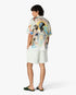 Short sportif vert en lin à rayures et à fleurs