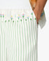 Short sportif vert en lin à rayures et à fleurs