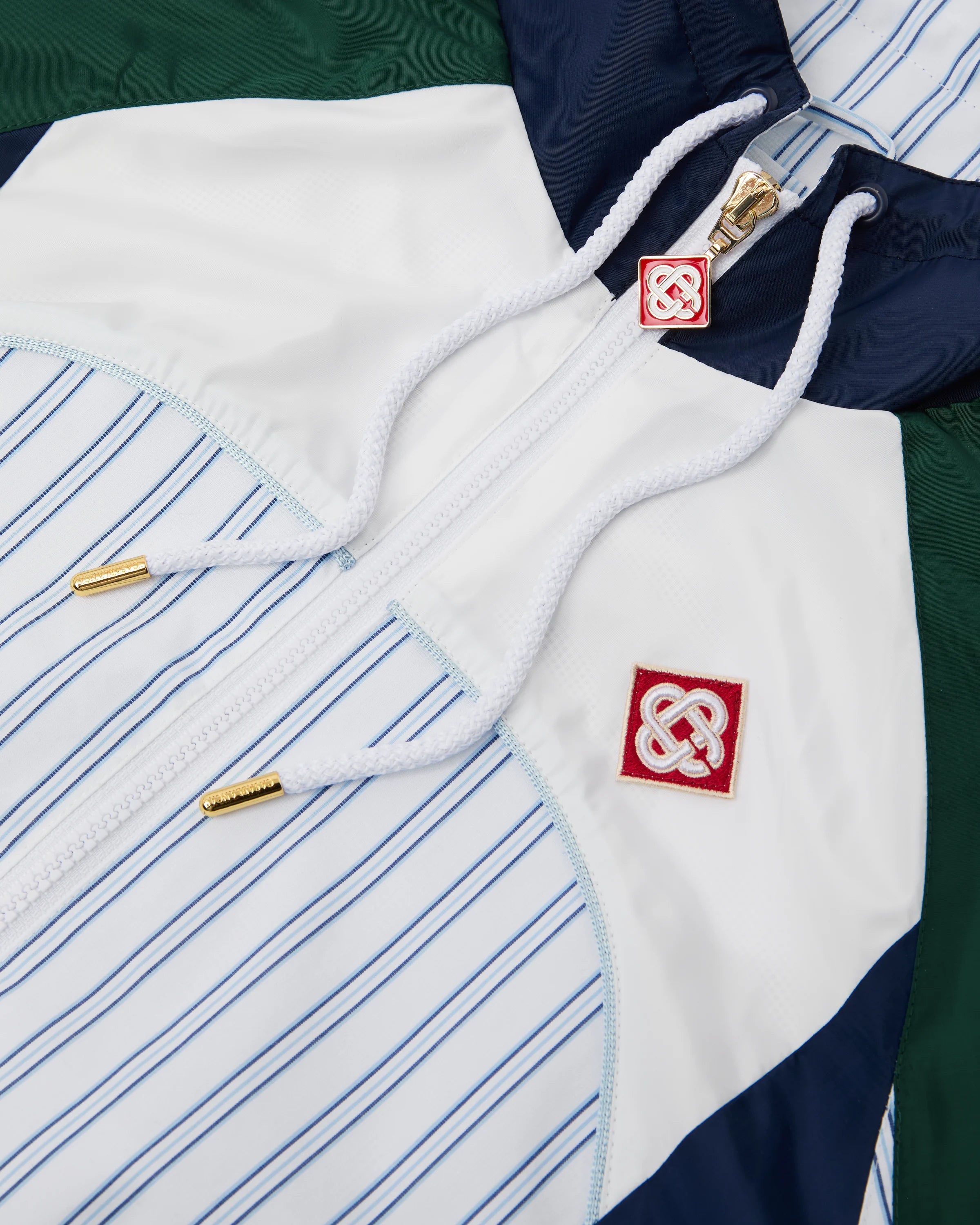 Veste de survêtement à empiècements à fines rayures blanches et bleu marine