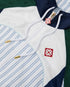 Veste de survêtement à empiècements à fines rayures blanches et bleu marine