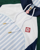 Veste de survêtement à empiècements à fines rayures blanches et bleu marine